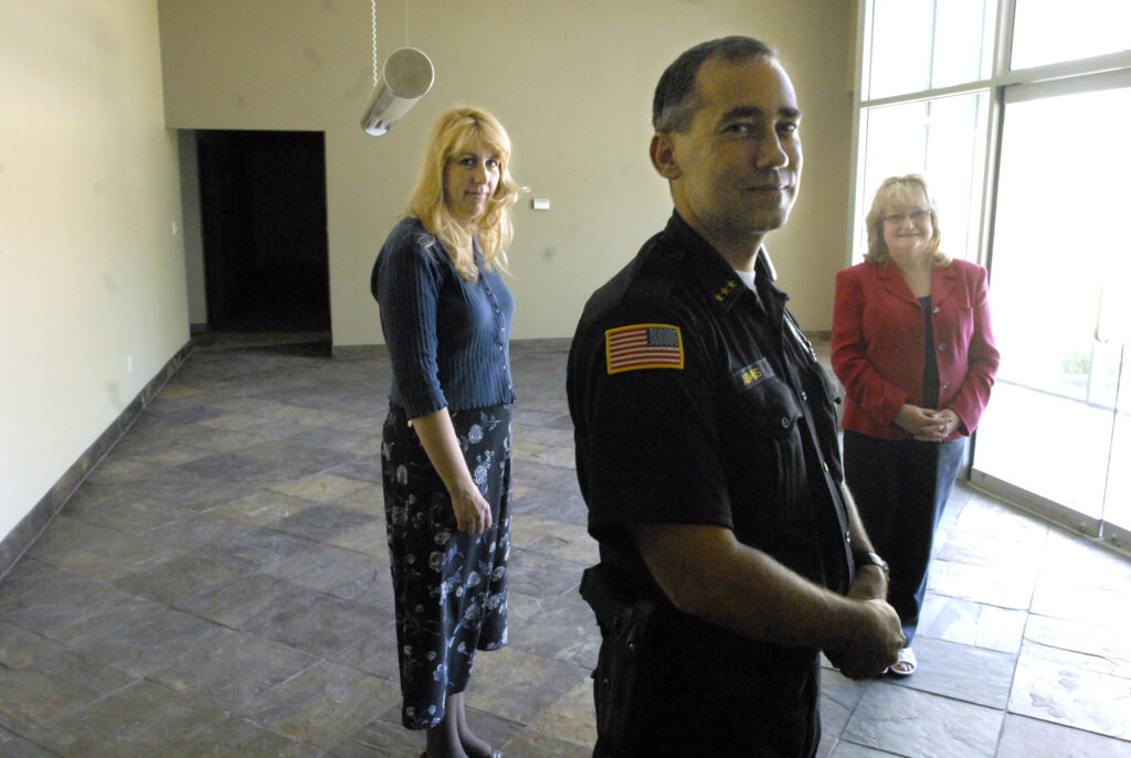 Image inside the Liberty Lake Police and Library building with Mayor Wendy Van Orman (Left), Police Chief Brian Asmus (Center), and Library Director Pamela Mogen (Right).